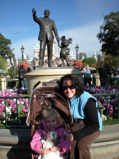 SGK and Bella in front of the Walt Disney statue