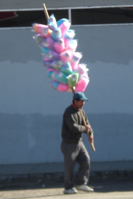 Cotton candy seller : Don't know where he was headed; but we waylaid him for some.