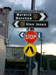 Sign reads: New England Highway Warwick Bonshaw 15 15 Glen Innes