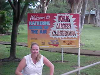 The sign behind SGK says: Welcome to Katherine School Of The Air Worlds Largest Classroom No Tour Today