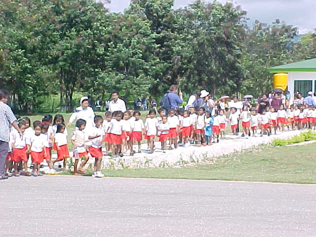 Indonesian children all lined up in their school uniforms.  .  Location: Suumba School, Tambolaka Flores, East Nusa Tengarra, Indonesia (Indonesia, The Travel Addicts, Flores)