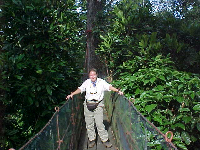 On the bridge : The longer the bridge, the more likely it was to twist under you as you walked across it (something that we would later remember as we crossed bottomless gorges in Nepal) (Malaysia, The Travel Addicts)