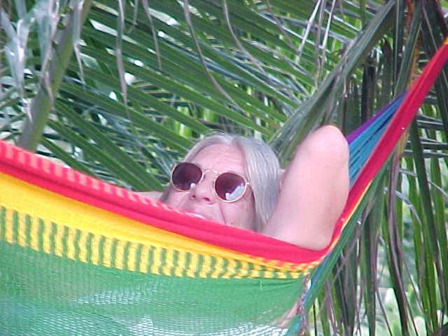 Jane relaxing in her usual pose :  (Thailand, The Travel Addicts)