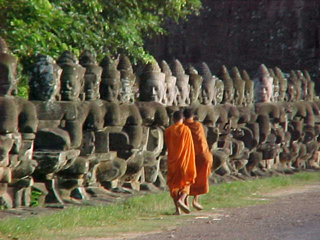 Monks at the victory gate :  (Cambodia, The Travel Addicts)