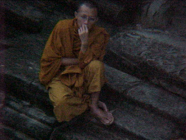 Buddhist Monks awaiting sunset in Angkor Wat's inner courtyard :  (Cambodia, The Travel Addicts)