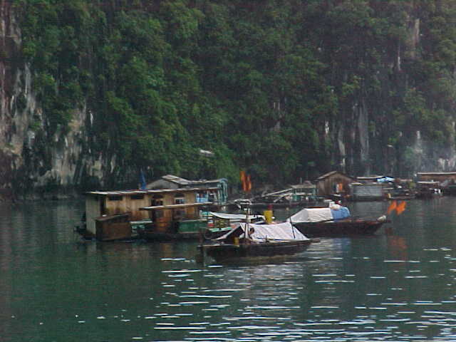 Floating village :  (Vietnam, The Travel Addicts)