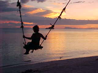 Israeli girl on swing at Cocohut :  (The Travel Addicts, Thailand)