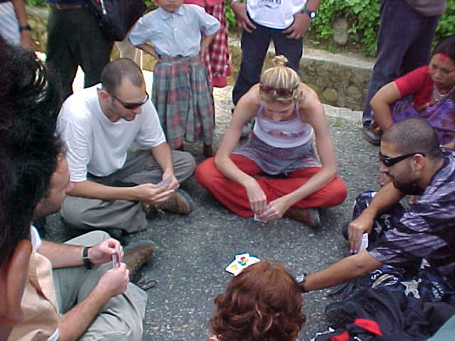 Card games : Israeli's kill time playing uno while waiting for the road to clear. They attracted quite an audience from the locals (Nepal, The Travel Addicts)