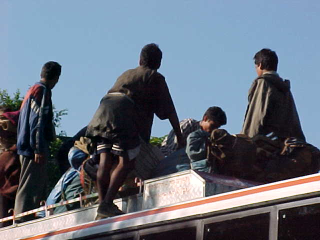 Loading the bus (Nepal, The Travel Addicts)