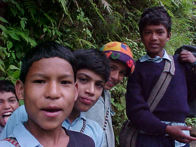 School children : The one in the colourful hat speeks perfect English and "wants to be a guide for Himalayan Encounters when he grows up." \  (Nepal, The Travel Addicts)