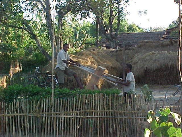 Cutting planks (Nepal, The Travel Addicts)