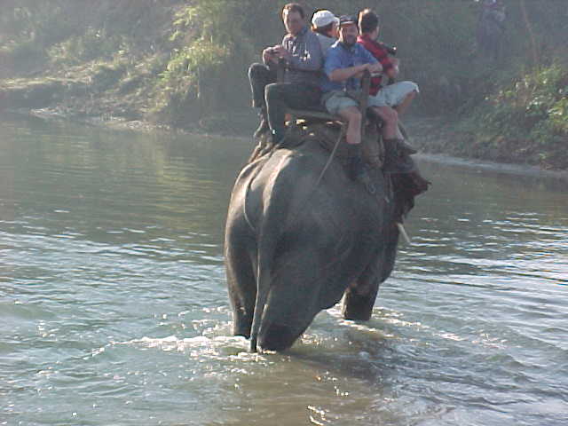 Crossing the river (Nepal, The Travel Addicts)