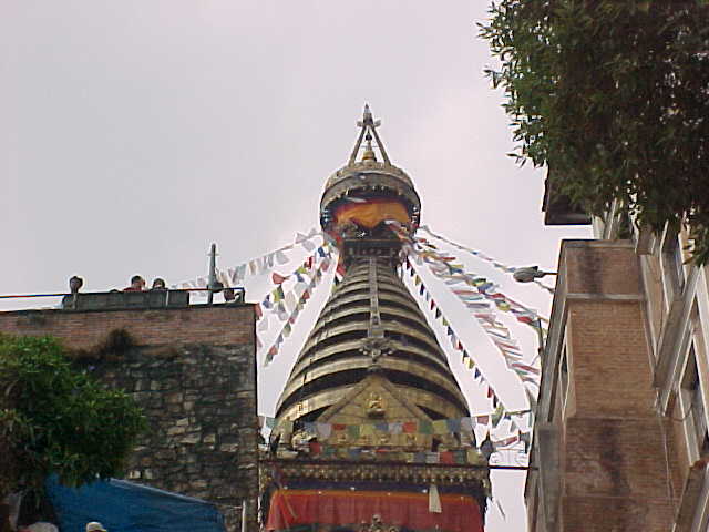 Pinicale of the stupa with prayer flags (Nepal, The Travel Addicts)