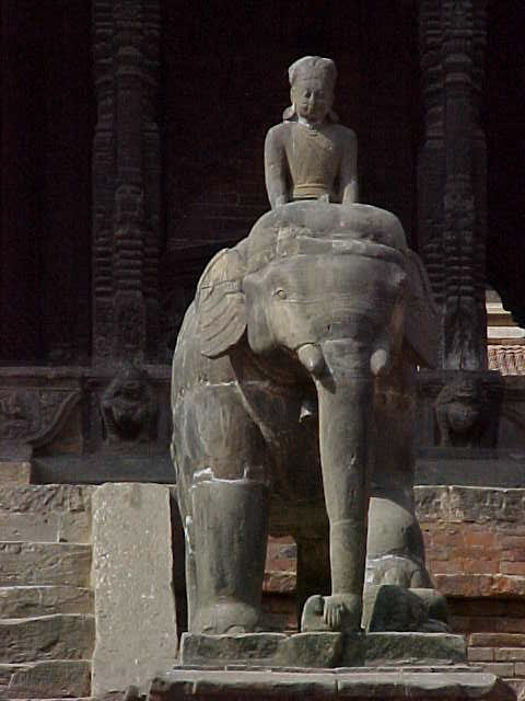 Legend has it that when the King returns to Patan, this bird will fly to the head of this elephant, and then the elephant will take a bath in the aligator fountain shown above. There is a hooka in the (vacant) palace here, awaiting the use of the returning king. A servant stokes freshly every day just in case the Elephant takes his bath (signalling the return of the king) (Nepal, The Travel Addicts)