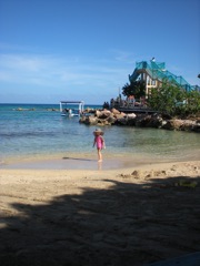 Bella wanders down the beach