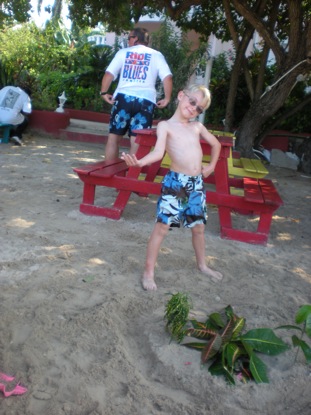 Michelangelo showing off his sand castle and foliage