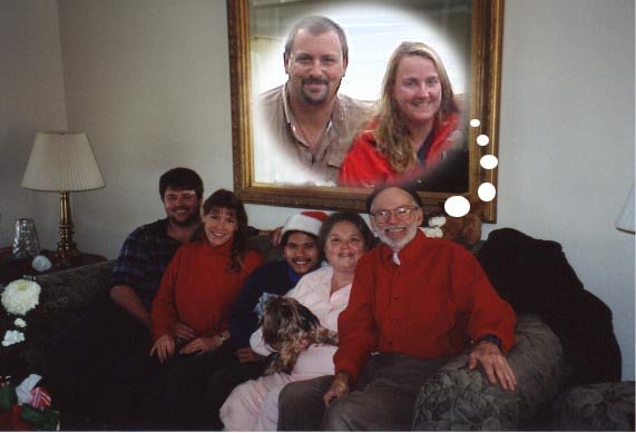 Joe Keenan, Kathy Swystun-Keenan, Kevin Keenan, Helen Sweeney-Keenan (holding Misha) and W. Andrew Keenan sitting on couch imagining Michael Alessio and SaraGrace Keenan.  Photoshopped by Kathy